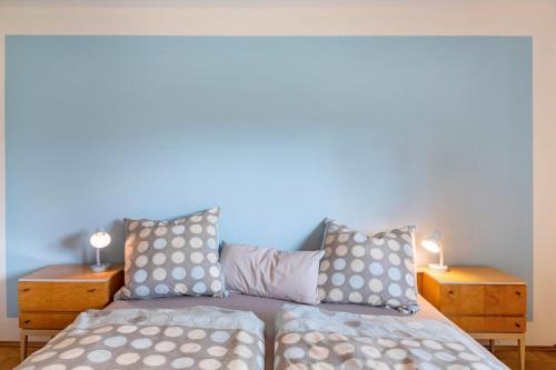 a bedroom with two beds and two night stands at Wildbiene bis 4 Pers in Freiensteinau