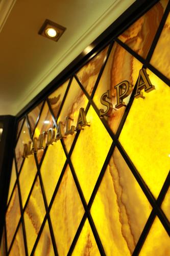 a stained glass window of a store with a sign at Golden Palace Hotel Yerevan in Yerevan