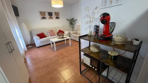 a living room with a red blender on a table at La Paserina in Arenas de Cabrales