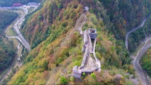 an aerial view of a hill with a train on it at Casa Narcisa in Verneşti