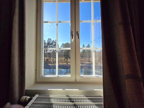 a window in a room with a view at Norrqvarn Hotel & Resort by Vänerport in Lyrestad