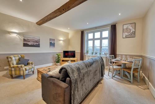 a living room with a couch and a table at Harrow Croft, 2 Bed Apartment, St Johns, Worcester in Henwick