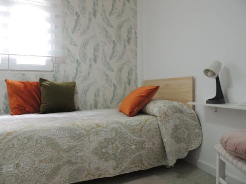 Postel nebo postele na pokoji v ubytování Casa Inés Corcubión
