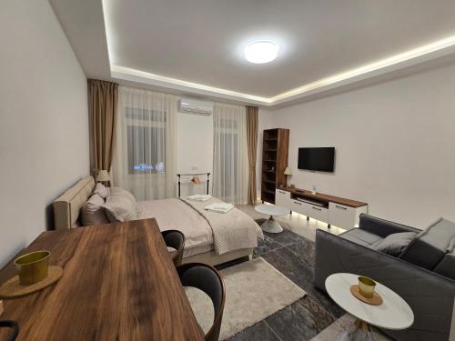 a hotel room with a bed and a couch at Slavija Residence Apartments in Belgrade