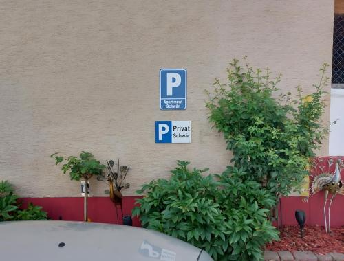 a parking sign on the side of a building at Apartment Schwär in Endingen
