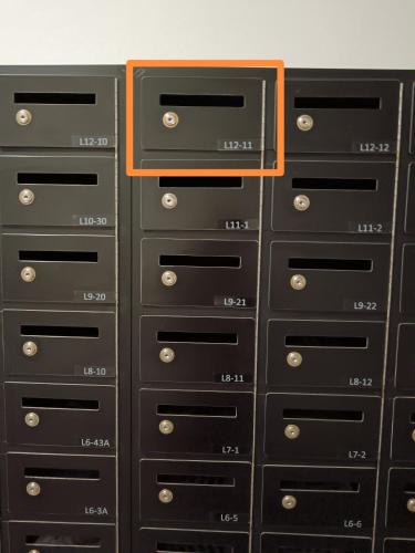 a group of drawers with an orange label on them at Appartment Homestay Kota Samarahan in Kota Samarahan