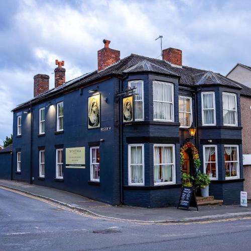 a blue building on the side of a street at The Victoria in Newcastle under Lyme