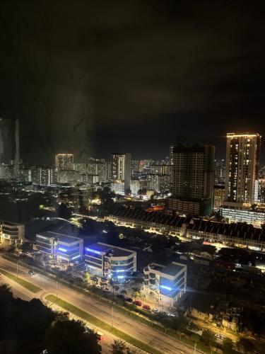 a city lit up at night with buildings at Jac Urban Suites Luxury & Premium Staycation 10pax in George Town