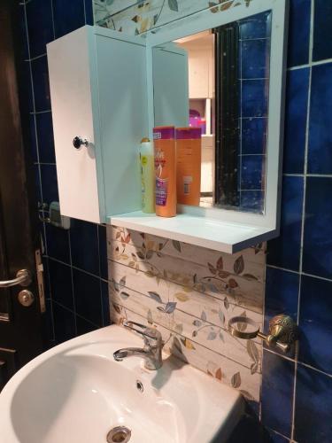 a bathroom with a sink and a mirror at Porto Matrouh Unique Chalet 73004 in Marsa Matruh