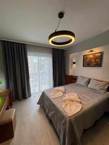 Кровать или кровати в номере Orange Garden Aparts & Hotel THE NORDIC