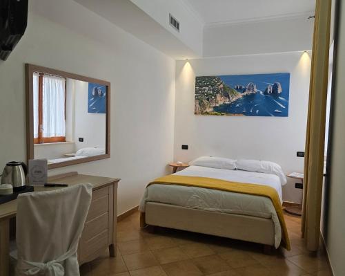 Postel nebo postele na pokoji v ubytování Hotel Il Nido Sorrento