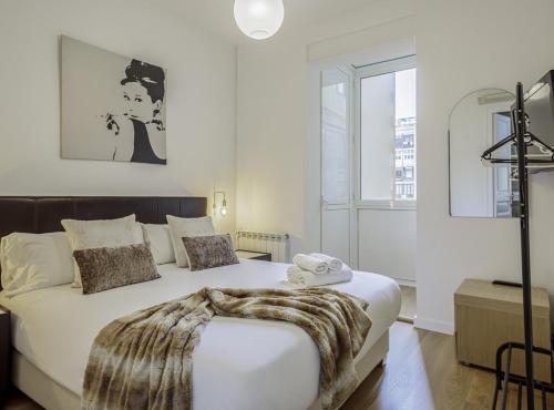 Posteľ alebo postele v izbe v ubytovaní The Gaudi Suites II
