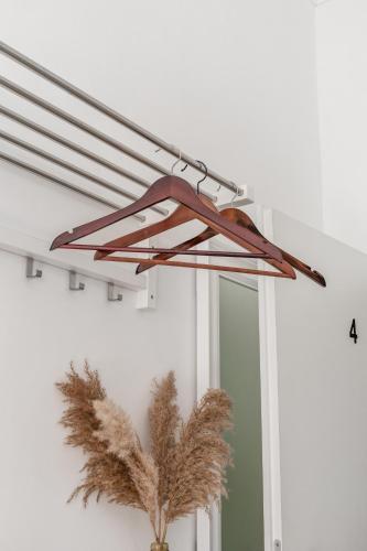 a light fixture on a wall with a mirror at Modern Stay I Cosy & Central Apartments in Koblenz