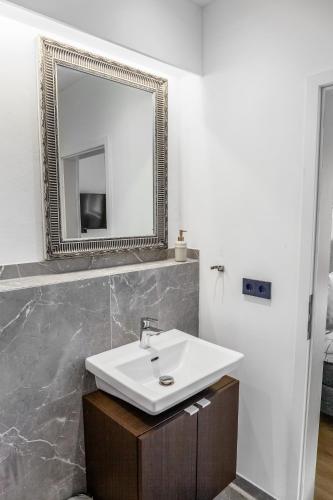 a bathroom with a sink and a mirror at Modern Stay I Cosy & Central Apartments in Koblenz