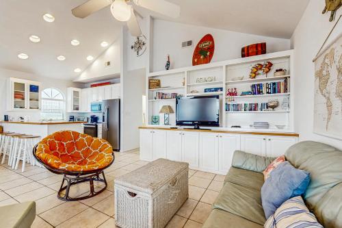 a living room with a couch and a table at Take It Sea Z in Gulf Shores