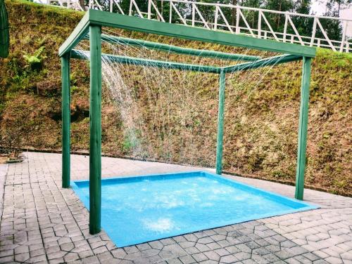 a swimming pool with a net over it at Sítio Pedacinho do Céu na Serra Catarinense in Rancho Queimado