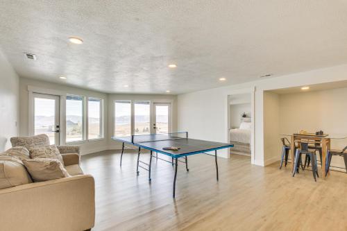 a living room with a couch and a table at 5 Mi to Bear Lake State Park Home with Deck in Garden City