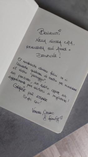 a piece of paper with handwriting on it at La Casa Di Memole in Giaveno