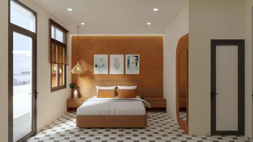 a bedroom with a bed with orange pillows at SKY Homestay in Hue