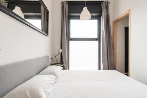 Postel nebo postele na pokoji v ubytování Peaceful Loft - Rho Fieramilano