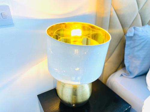 a blue vase sitting on top of a table at KS Stylish Studio Apartment in Accra
