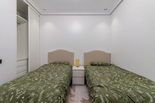 Postel nebo postele na pokoji v ubytování Dar Alisios 2