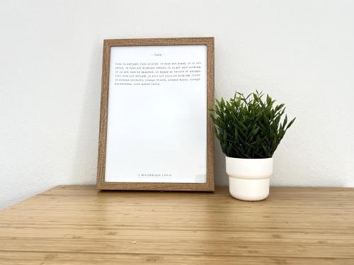 a picture frame sitting on a table next to a plant at Roark A202, Indoor & Outdoor Pools, Fitness Center in Branson