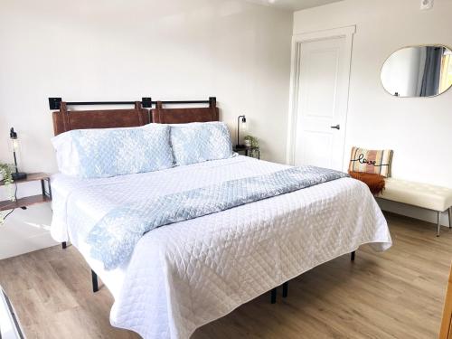 a bedroom with a large bed with a white comforter at Roark A202, Indoor & Outdoor Pools, Fitness Center in Branson