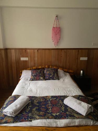 Ένα ή περισσότερα κρεβάτια σε δωμάτιο στο Twin garden Homestay