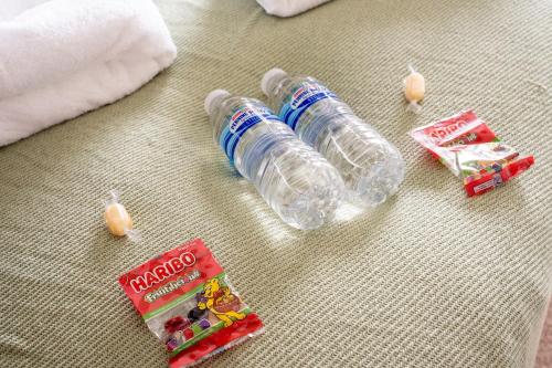 a couple of bottles of water sitting on a table at Marina House in Bathgate