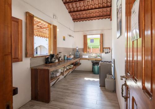 a kitchen with a counter and a sink at 3BR Home Near Beach, Pool, Local Vibes in Manzanillo