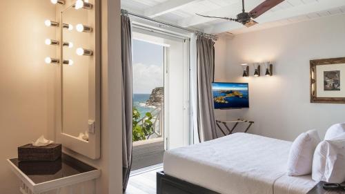 Ένα ή περισσότερα κρεβάτια σε δωμάτιο στο Villa II Faro - Luxury in St Barths