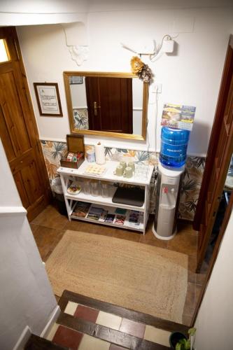 a bathroom with a sink and a mirror at Alojamiento La Escalera in Alhama de Granada
