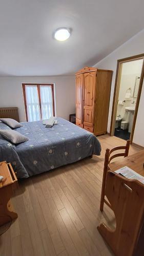 Cama ou camas em um quarto em Hotel Blanchetti