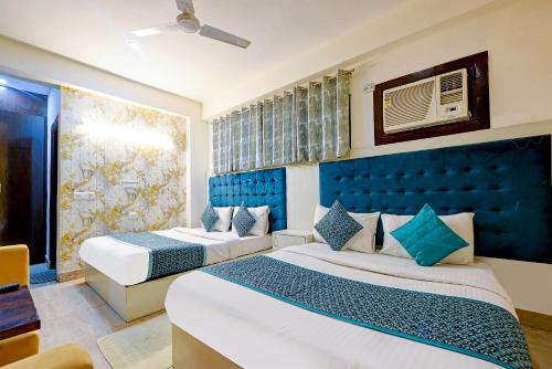 Ένα ή περισσότερα κρεβάτια σε δωμάτιο στο Hotel The White Sand Suites