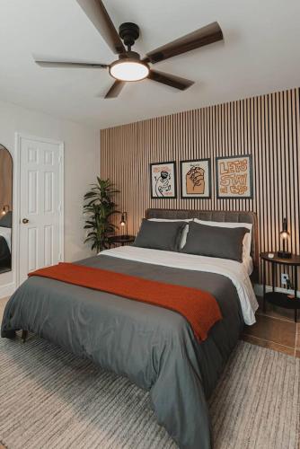 a bedroom with a large bed with a ceiling fan at Cozy Miami Suite with FREE Parking in Miami