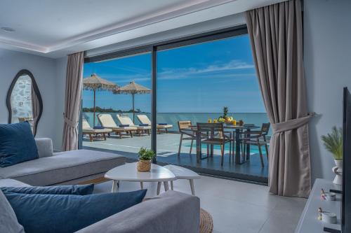 a living room with a view of the ocean at Jasmina Villas in Agios Nikolaos