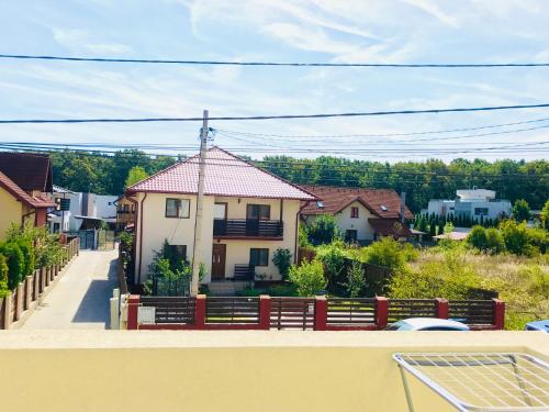 a view of a house from the balcony at Apartament elegant - Cozy home residence in Piteşti