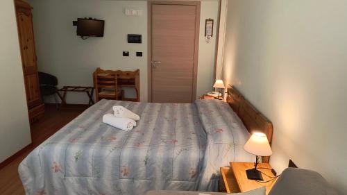 Cama ou camas em um quarto em Hotel Blanchetti