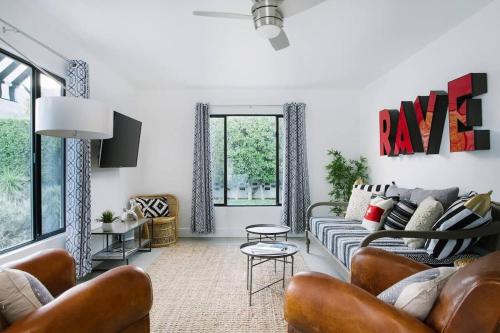 a living room with a couch and a table at Hotel El Cid by AvantStay Mid-Century Charm with Poolside Cabanas in Palm Springs