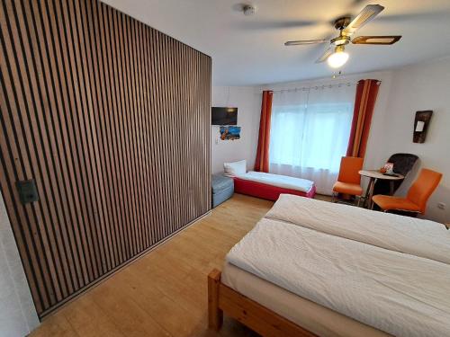 a bedroom with a bed and a living room at W.I.P. Welt im Park in Dresden