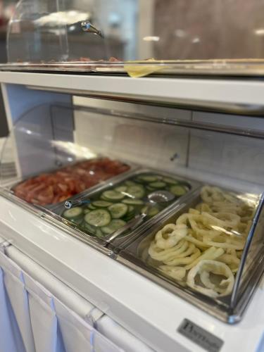 a display case with many different types of food at Vadkert Major in Sárvár