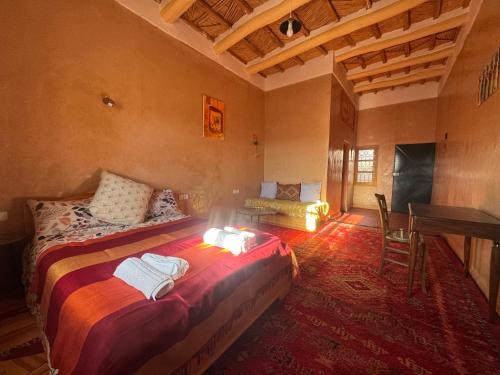 Postel nebo postele na pokoji v ubytování KASBAH ALTAÏR