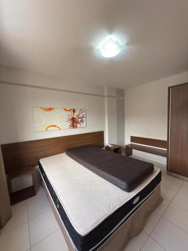 a bedroom with a large bed in a room at Thermas Boulevard Suíte Hotel - Weigly in Caldas Novas