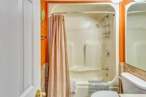 a bathroom with a shower and a toilet at Oceanfront Condo with Balcony in Myrtle Beach! in Myrtle Beach