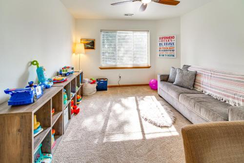 a living room with a couch and a table at Klamath Falls Getaway with Pool and Hot Tub Access! in Klamath Falls