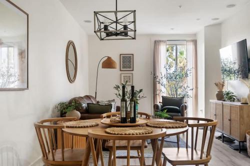 a living room with a table and chairs at Down Town Condo with gym pool BBQ jacuzzi in San Diego