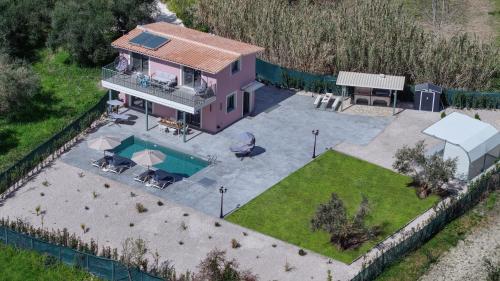 an aerial view of a house with a swimming pool at Valley House in Vasiliki