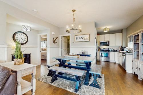 a living room with a table and a kitchen at Lake View Paradise in La Follette