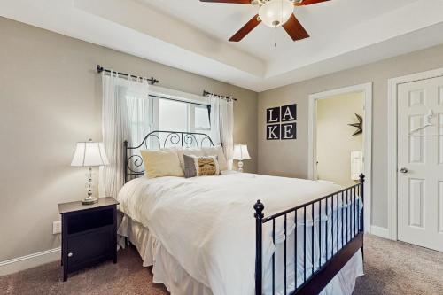 a bedroom with a bed and a ceiling fan at Lake View Paradise in La Follette